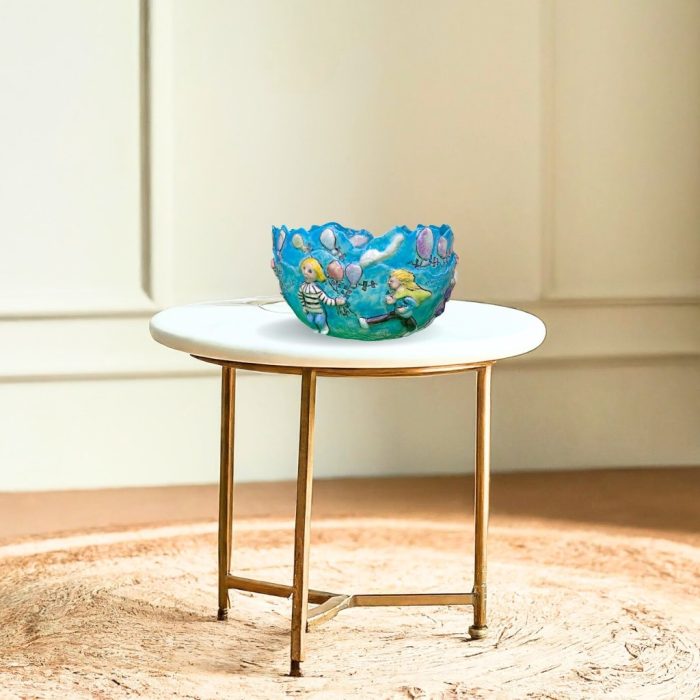 Artistic home decor featuring a cloud-decorated bowl.