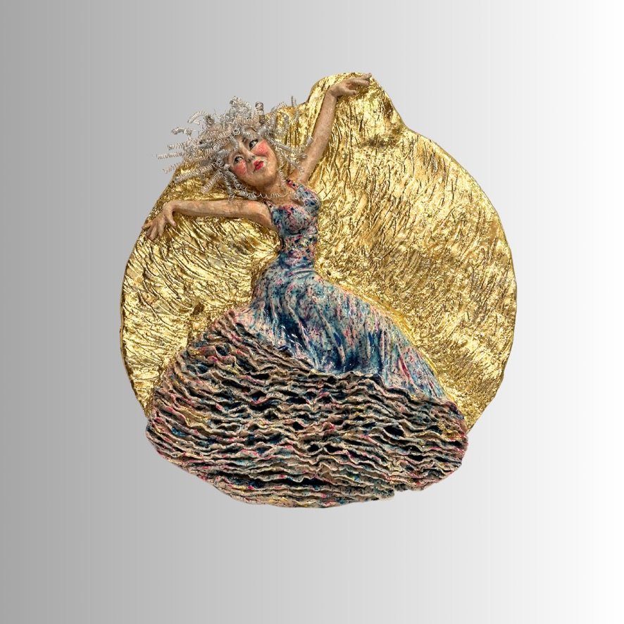 Handmade wall sculpture of flamenco dancer in a vibrant multi-coloured dress on a golden background
