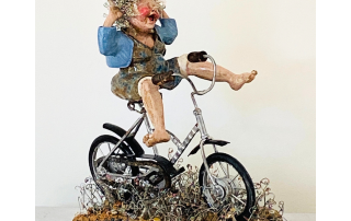 Figurative ceramic artwork showing joy and freedom through movement.