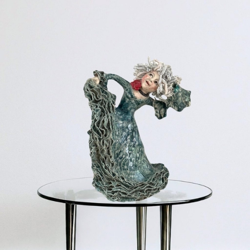 Handmade ceramic dancer in blue and green dress with red rose choker.