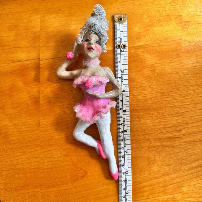 Elegant ballerina wall art featuring a graceful dancer poised on one leg.