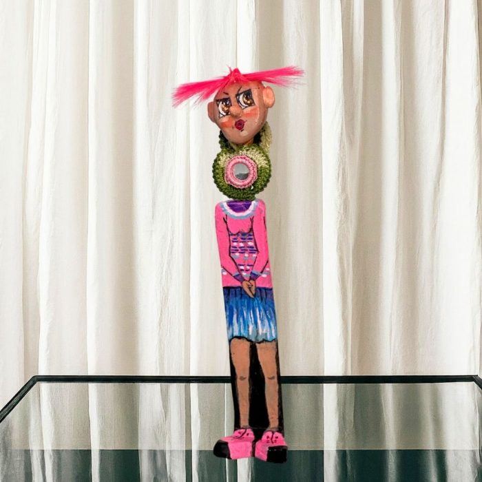 A themed ceramic body supports a stainless steel rod-mounted character head.