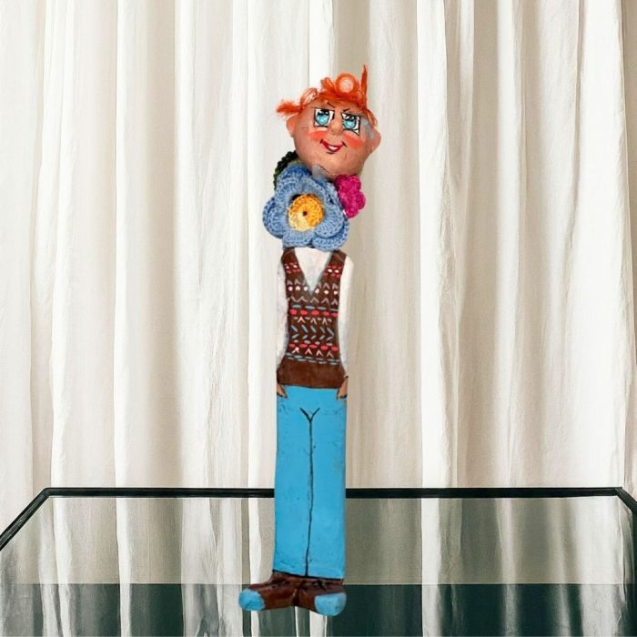 The brightly coloured whimsical ceramic figure for home decor with a detachable head.