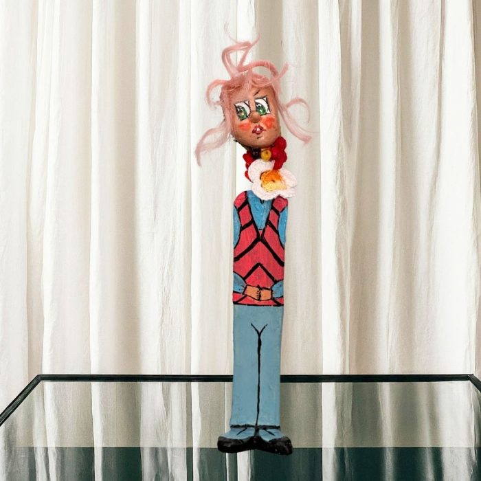 Hand-sculpted ceramic flower figure with a fun personality and artistic details.