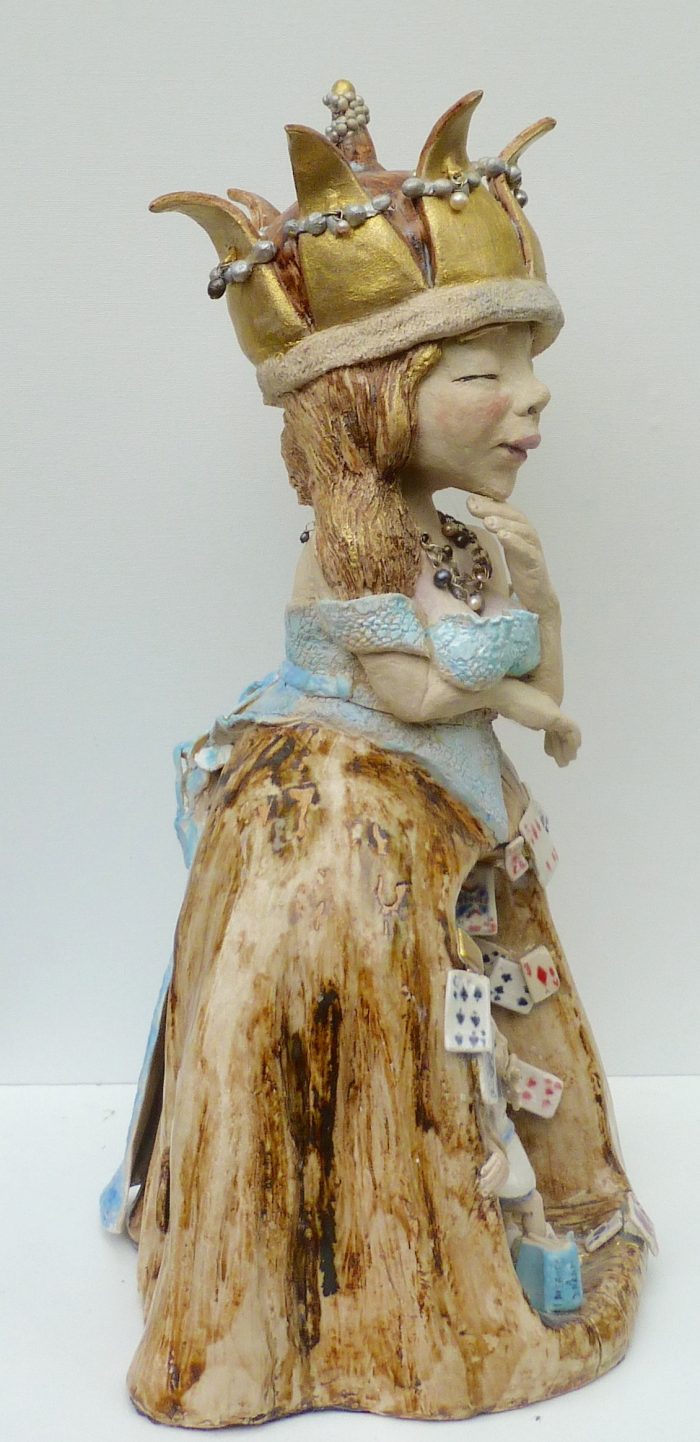 Queen of Hearts ceramic sculpture with regal pose.