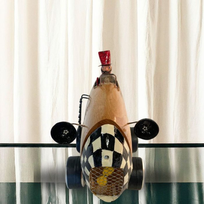 Mark Albon's handcrafted wooden racing car with a polished finish