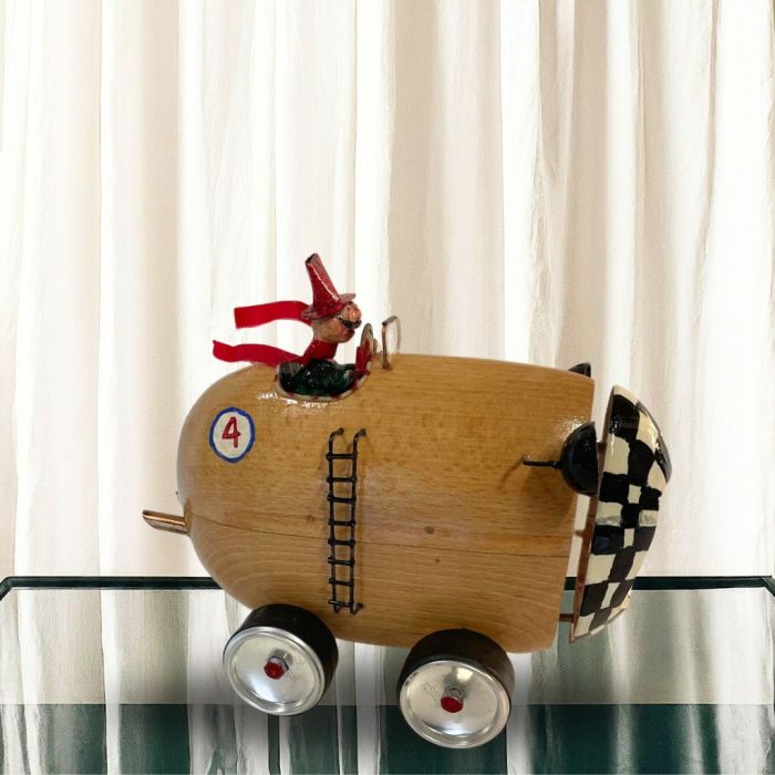 Handcrafted cherry wood racing car sculpture with intricate details